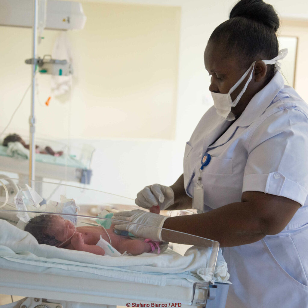 Maternity. Nurse Taking Care Of A Baby.