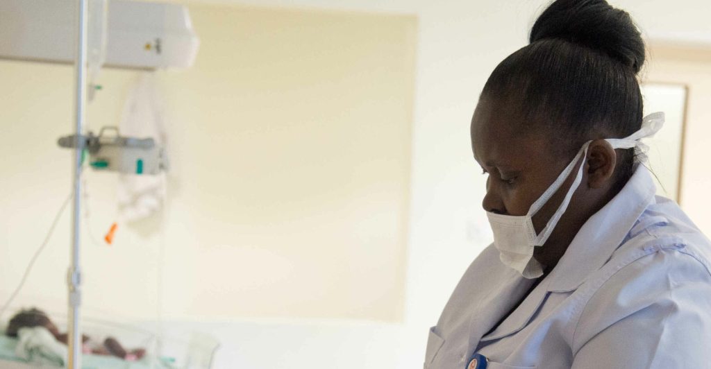 Maternity. Nurse Taking Care Of A Baby.