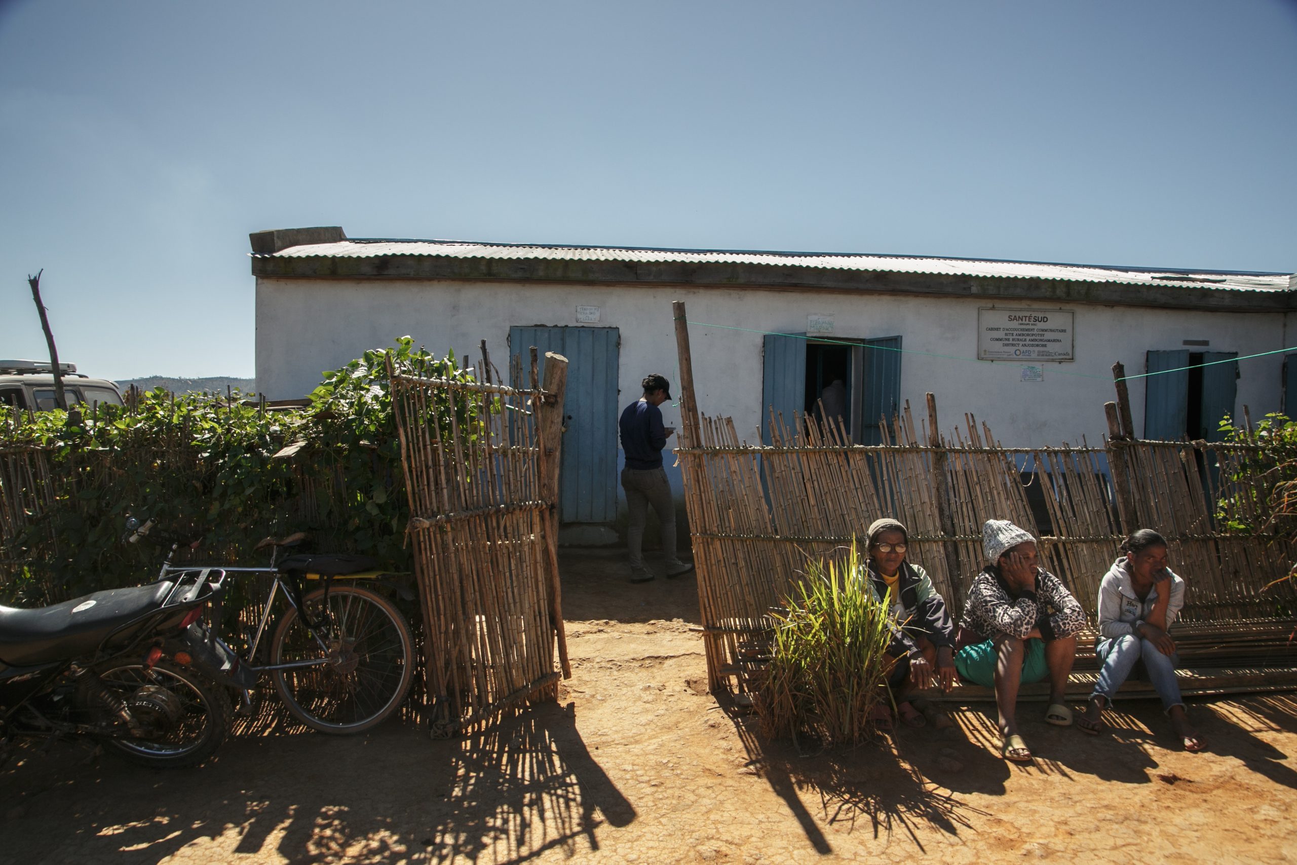 Family members waiting in front of the community birth clinic