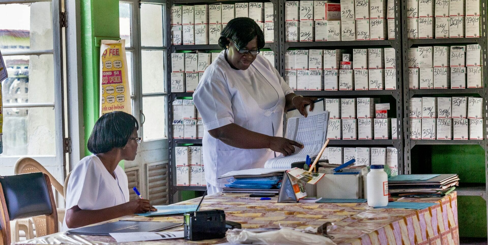 Nurses at work at a tuberculosis hospital in Ibadan, Nigeria. 

In 2016, the Global Fund, Nigerian government and other key partners initiated the National Supply Chain Integration Project (NSCIP) to address the country’s health product supply chain challenges. Issues included, parallel supply chains, low capacity and inadequate reporting, inefficiencies due to poor coordination and sub-standard warehousing. These challenges resulted in frequent stock-outs, poor availability of medicines, millions of dollars in expired drugs, and long lead times. 

The Nigerian government and donors recognized a concerted effort was needed to integrate supply chains and deliver structural change. Together with the government, the Global Fund and donors targeted efforts to improve data visibility, coordinate government authorities, optimize warehousing and distribution networks, and manage supply levels at the State level.

NSCIP has achieved improvements across key supply chain performance areas, and improved visibility has helped in the proactive re-distribution of products before expiry. This means that medicines and health products can reach patients who need them most, when they need them. 

NSCIP demonstrates the key Global Fund principle of country ownership and partnership. The Global Fund continues to work closely with the Nigerian government to further strengthen capacity to ensure full country ownership of the supply chain, supported by third party logistics providers and partners. The success in Nigeria was not an isolated effort; it required tremendous cooperation and coordinated funding with many partners in-country. Without the support of partners, implementation would not have been possible.

The Global Fund / Andrew Esiebo